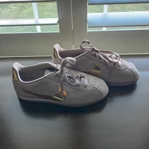 Worn once nike Cortez size 7.5 mauve with gold swish